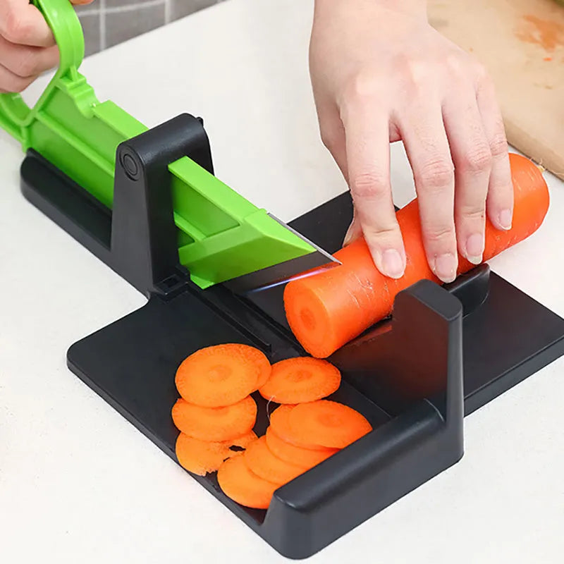 Green vegetable cutter with stainless steel blades for slicing carrots and potatoes