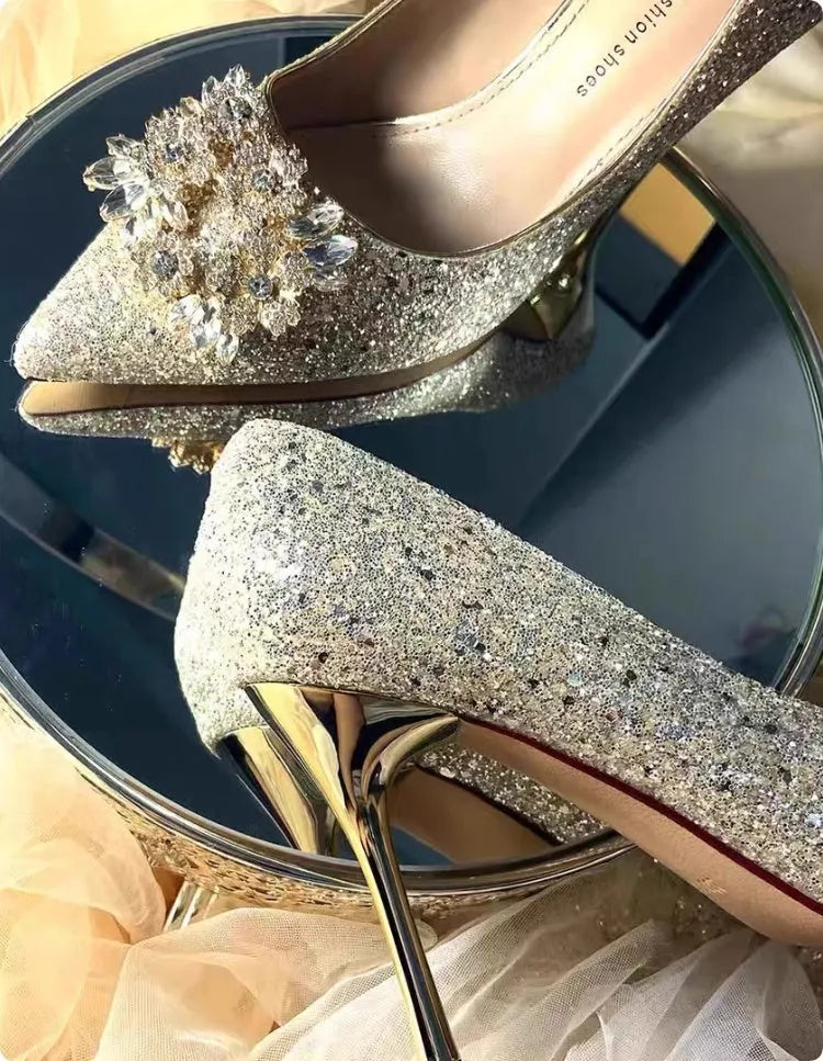 Champagne Xiuhe wedding shoes with rhinestone flower pattern and pointed toe on a fine heel.