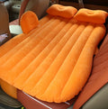 Black inflatable car bed with flocking material in five-seater vehicle rear