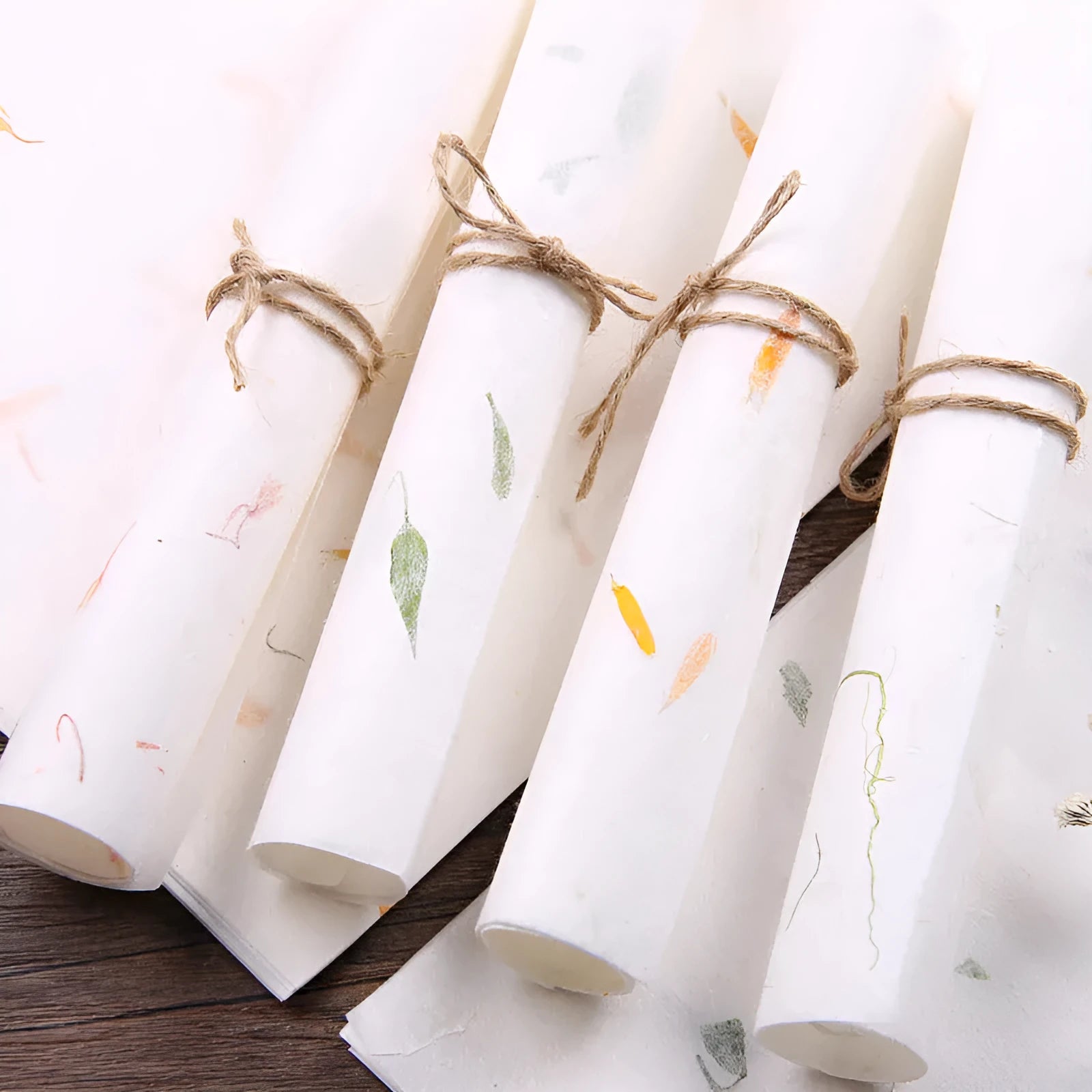 Ten sheets of Chinese ancient-style painting paper in green, red, and yellow designs, measuring 27.5 by 16.7 cm