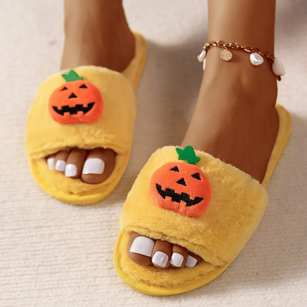 Halloween pumpkin plush slippers with open toe design showing synthetic fur uppers and PVC soles