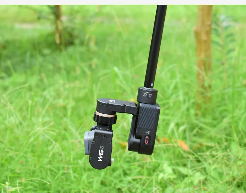 Black retractable selfie stick extended to full 100cm length with phone attached and Bluetooth remote control