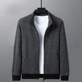 Men's black athletic jacket with stand-up collar and zip front, shown on a model.
