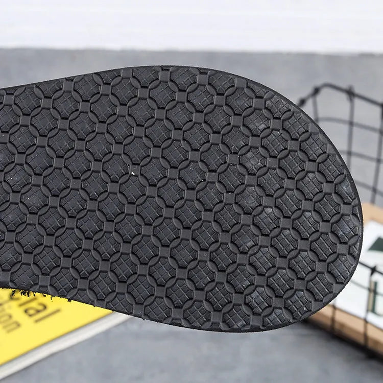 Women's bohemian slippers in brown with 5.5cm heel, high-elastic EVA upper, and rubber sole on a wooden floor.