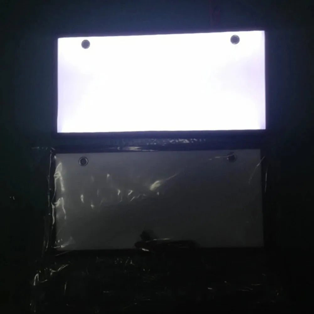 A pair of black plastic LED licence plate light bars for trucks on a white background.