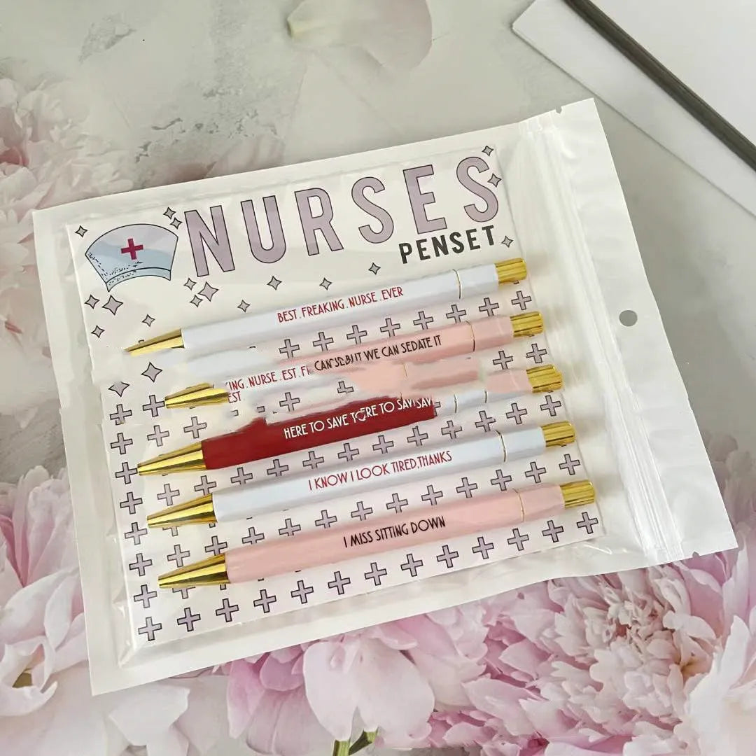 Five nurse theme ballpoint pens with humorous decoration arranged together