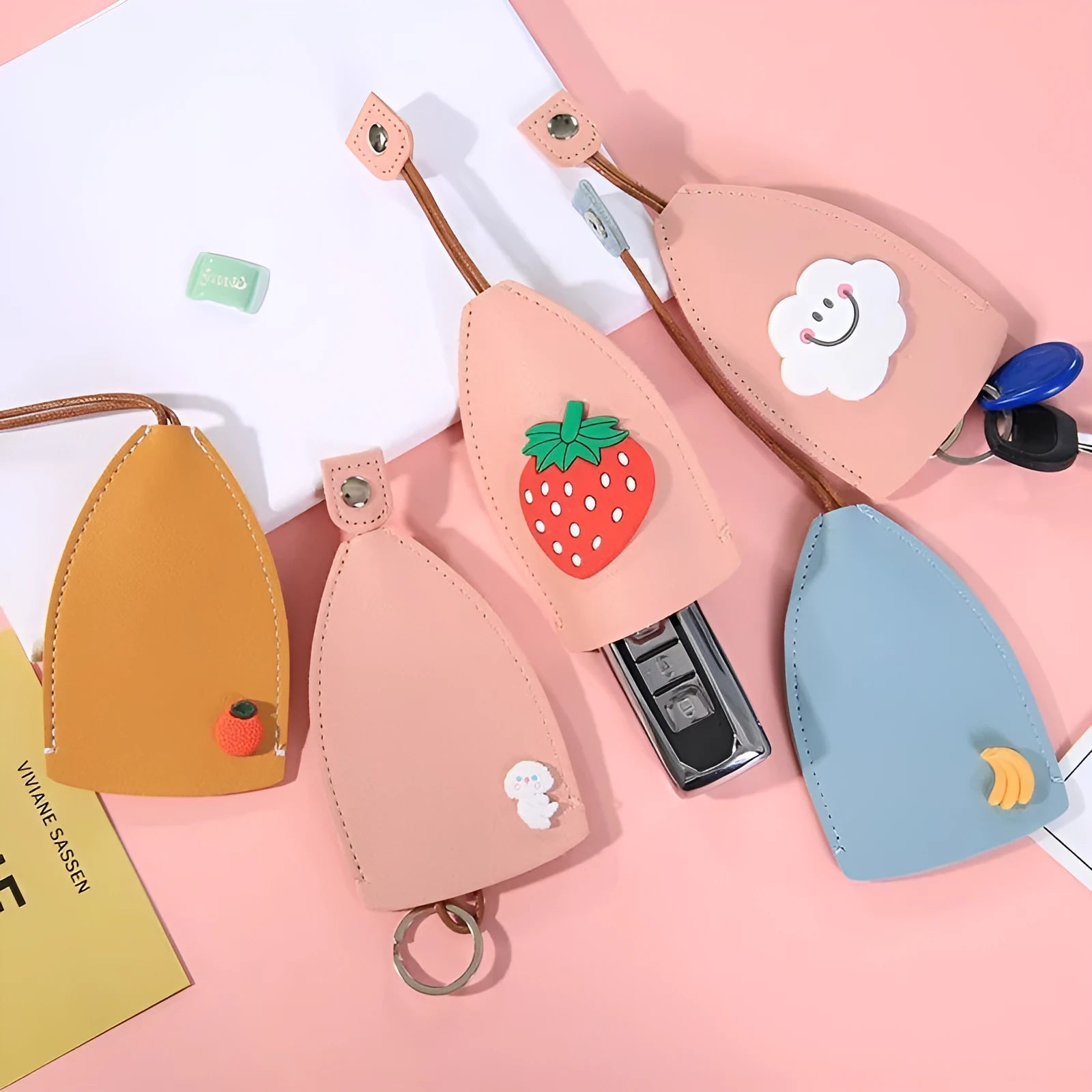 Cartoon pull-out key case in PU leather showing pull-out mechanism and colourful design options