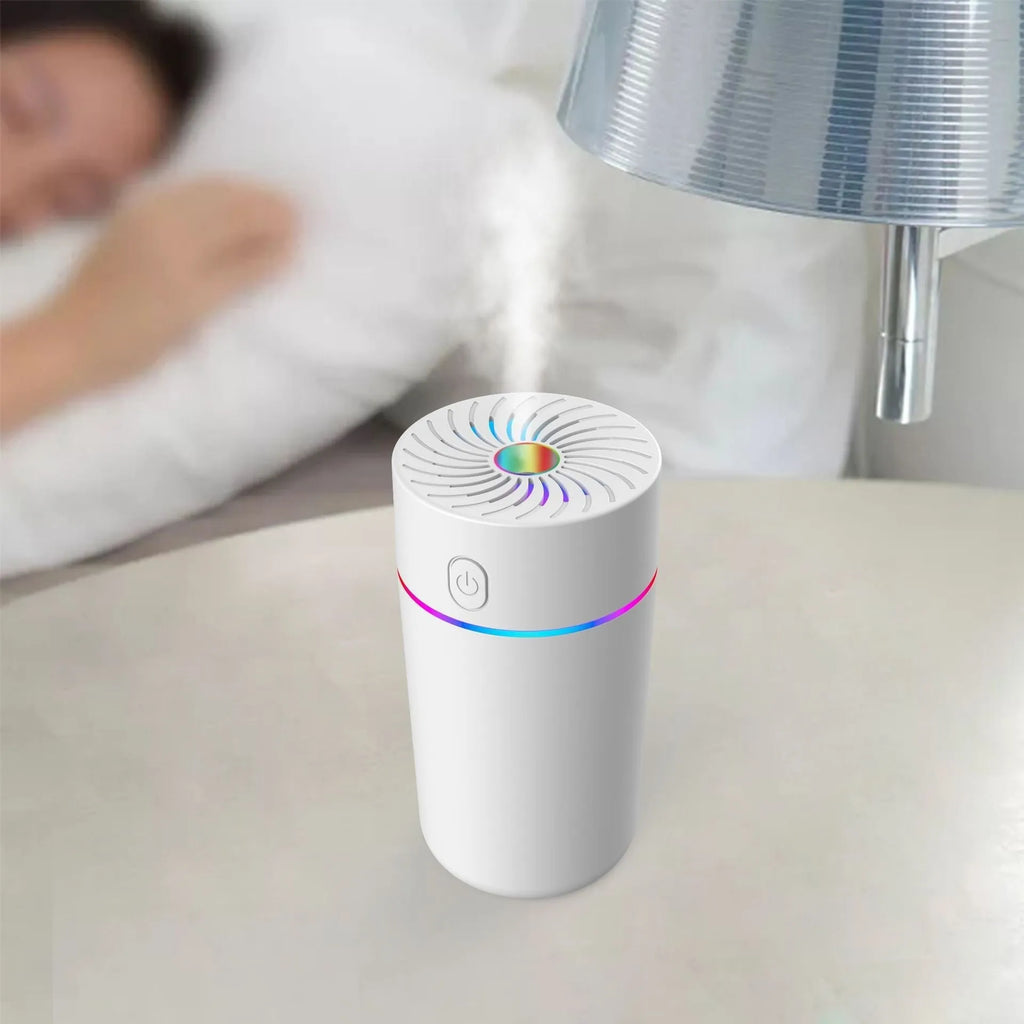USB car mini humidifier with aromatherapy function in black or white, showing compact design for vehicle use