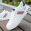 Sports shoes in black, grey, or white with mesh upper and cushioned sole