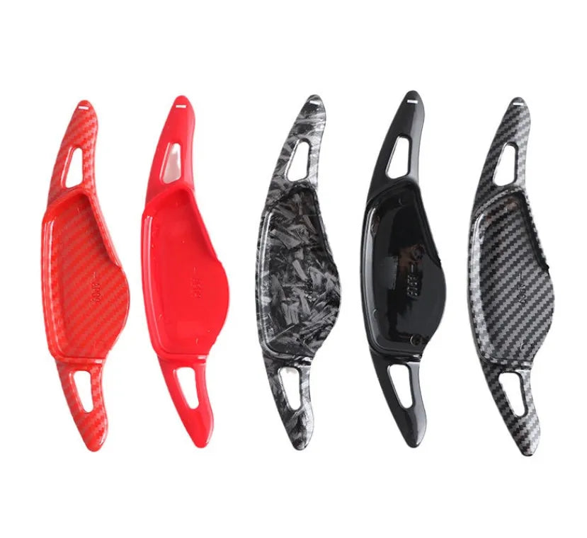 Car steering wheel paddle shifter modification in carbon fibre black finish on ABS plastic