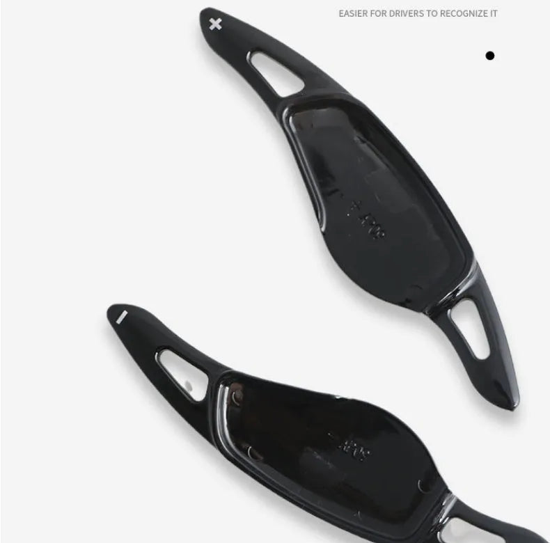 Car steering wheel paddle shifter modification in carbon fibre black finish on ABS plastic