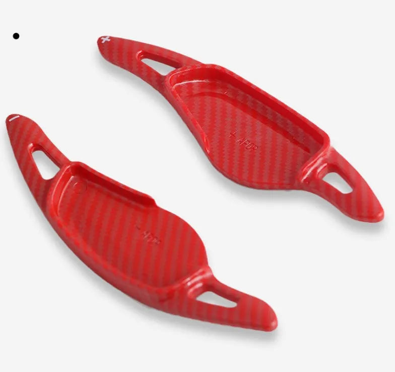 Car steering wheel paddle shifter modification in carbon fibre black finish on ABS plastic