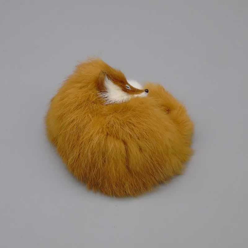 Small white artificial fox fur ornament for car or home decoration.
