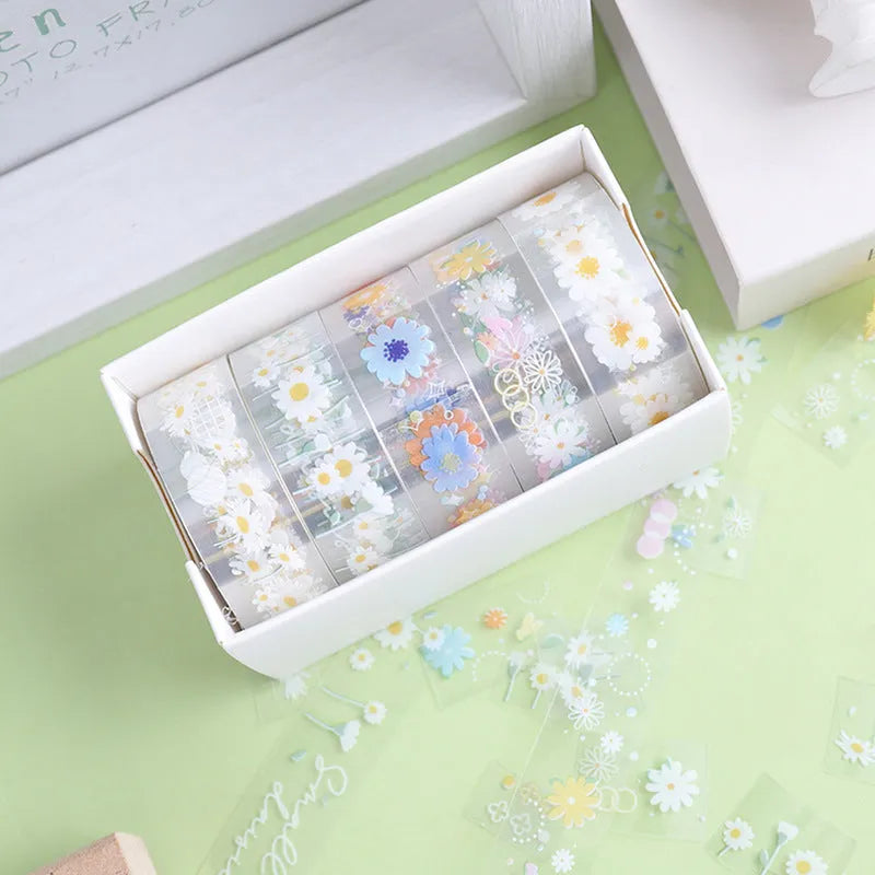 Five rolls of transparent adhesive tape with Midsummer Daisy decorative edge on clear PET polyester base