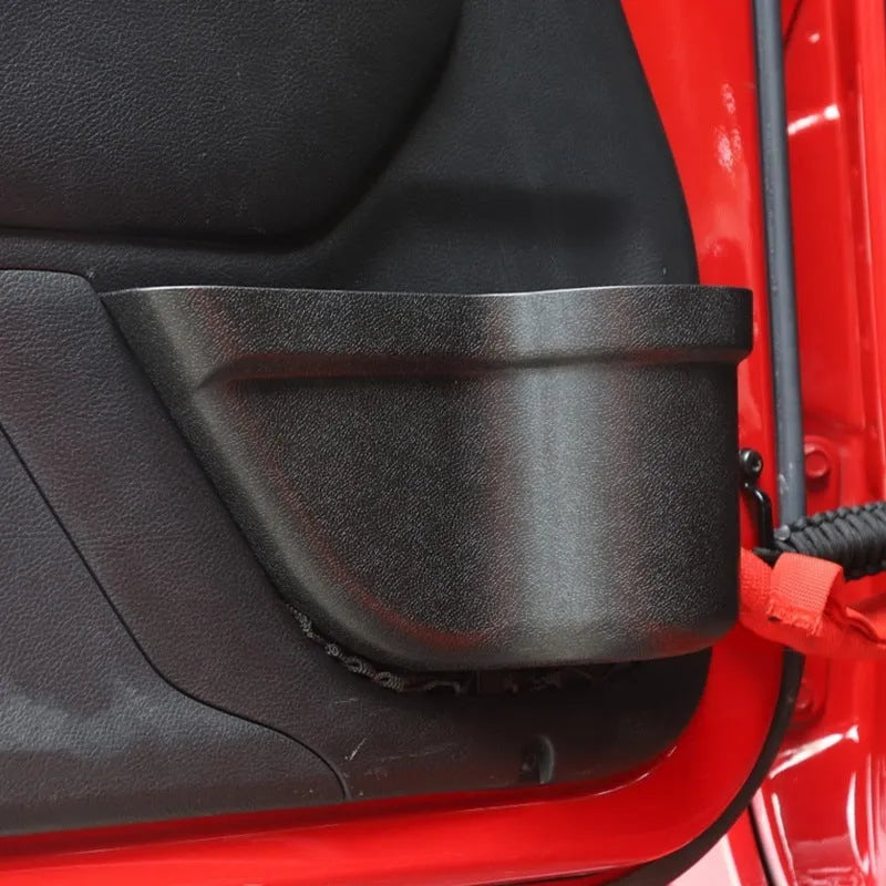 A pair of black aluminium alloy car interior storage boxes with net pockets for organising small items.