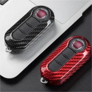 Carbon fibre and glass fibre replacement shell for a car key fob in black, red, and silver black colours.
