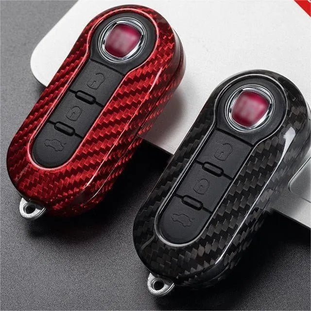 Carbon fibre and glass fibre replacement shell for a car key fob in black, red, and silver black colours.