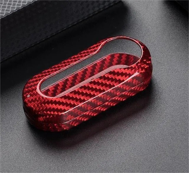 Carbon fibre and glass fibre replacement shell for a car key fob in black, red, and silver black colours.