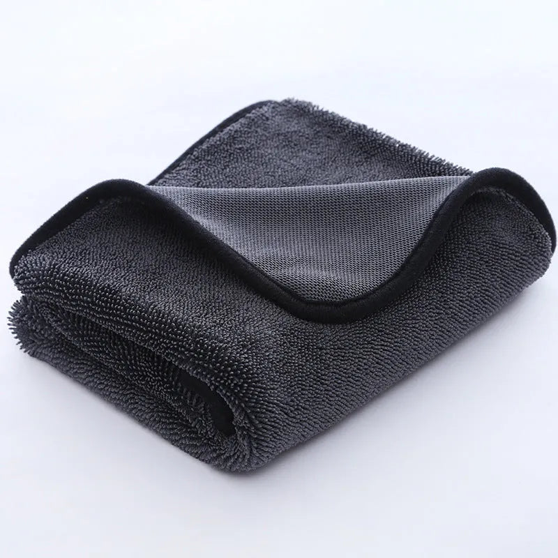 Grey car cleaning and pet bath towel with black hemmed edge, shown with a selection of different size options.