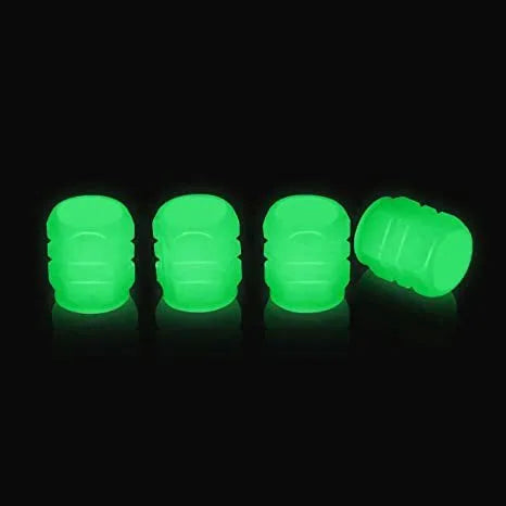 Pack of luminous rubber tyre valve caps glowing in green, blue, red, yellow, and pink colours.
