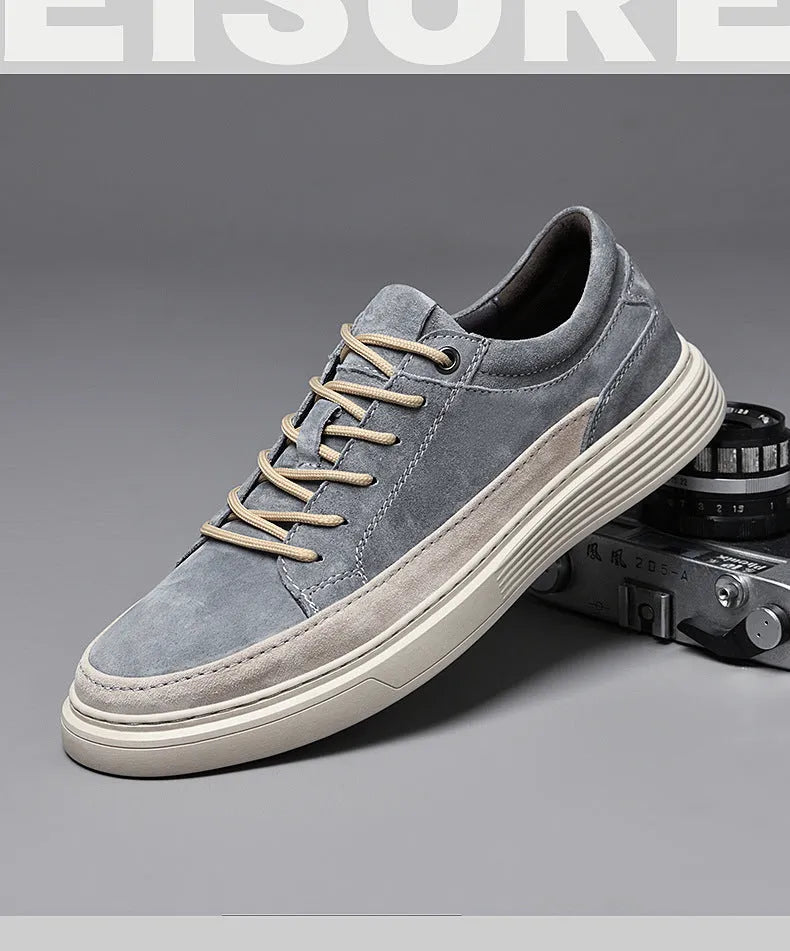 Men's grey casual skate shoes with pigskin upper and rubber sole showing lace-up front and round toe design