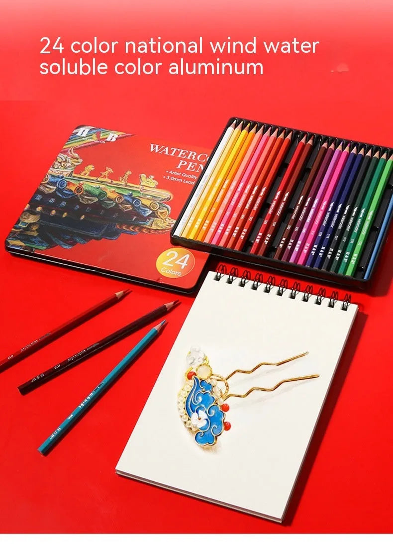Metal tin box open to show 24 water-soluble coloured pencils in wooden casings.