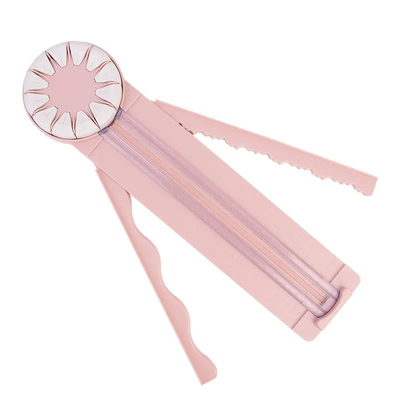 Pink and black 12-in-1 paper cutter with dotted plastic surface measuring 46.2cm