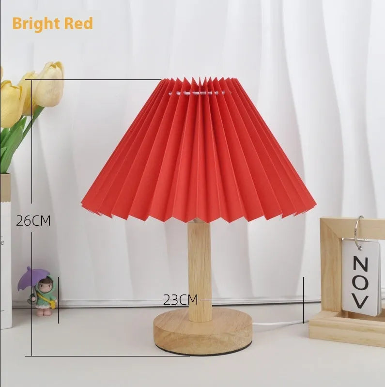Vintage pleated umbrella-shaped bedside lamp with remote control on bedside table