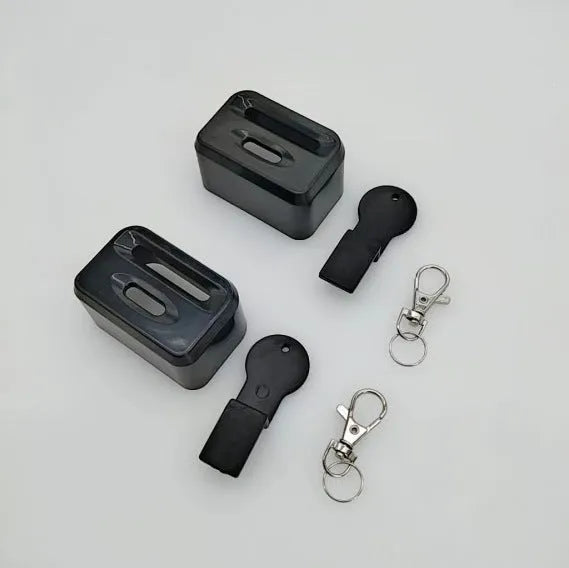 Seat belt buckle protective device in plastic ABS material shown in black and red colour options