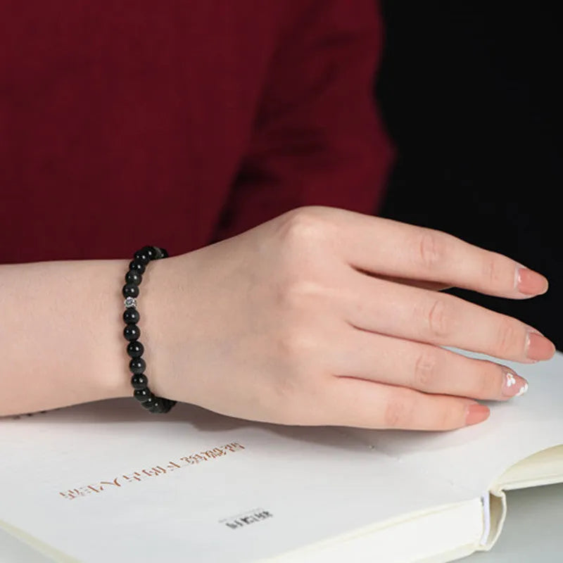 Natural obsidian and S925 silver bracelet with dragon phoenix constellation decorations.