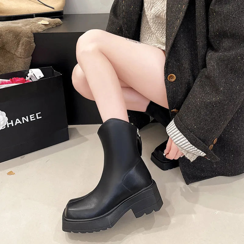 Black platform Martin boots for women with square toe, 6-8cm heel, and back zipper on a mid-calf shaft.