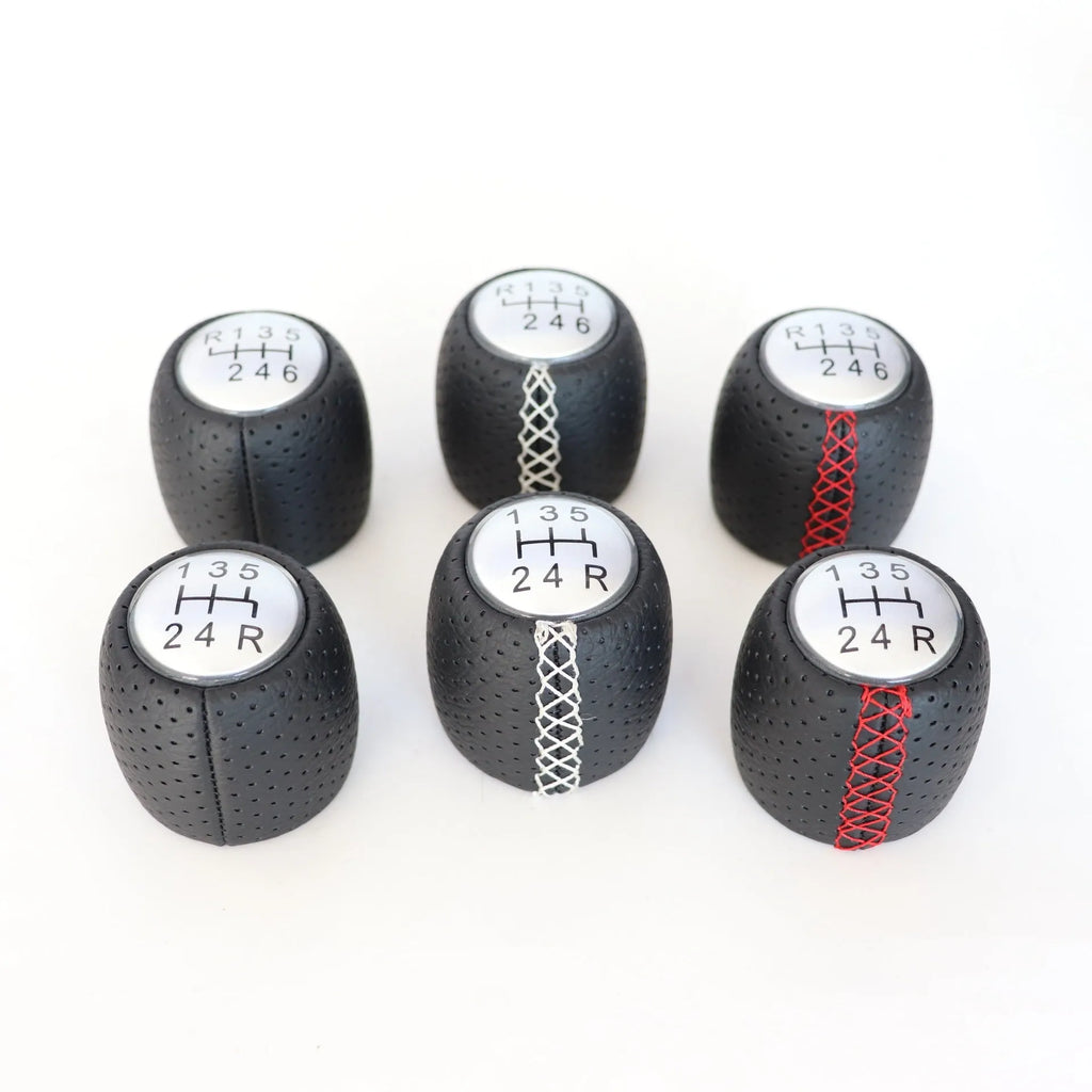 Sewn wrapped leather perforated handball gear for Alpha vehicles in matte and silver finishes