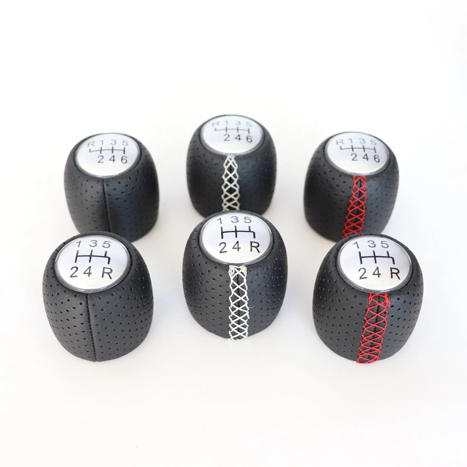 Sewn wrapped leather perforated handball gear for Alpha vehicles in matte and silver finishes