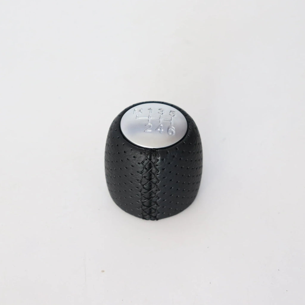Sewn wrapped leather perforated handball gear for Alpha vehicles in matte and silver finishes