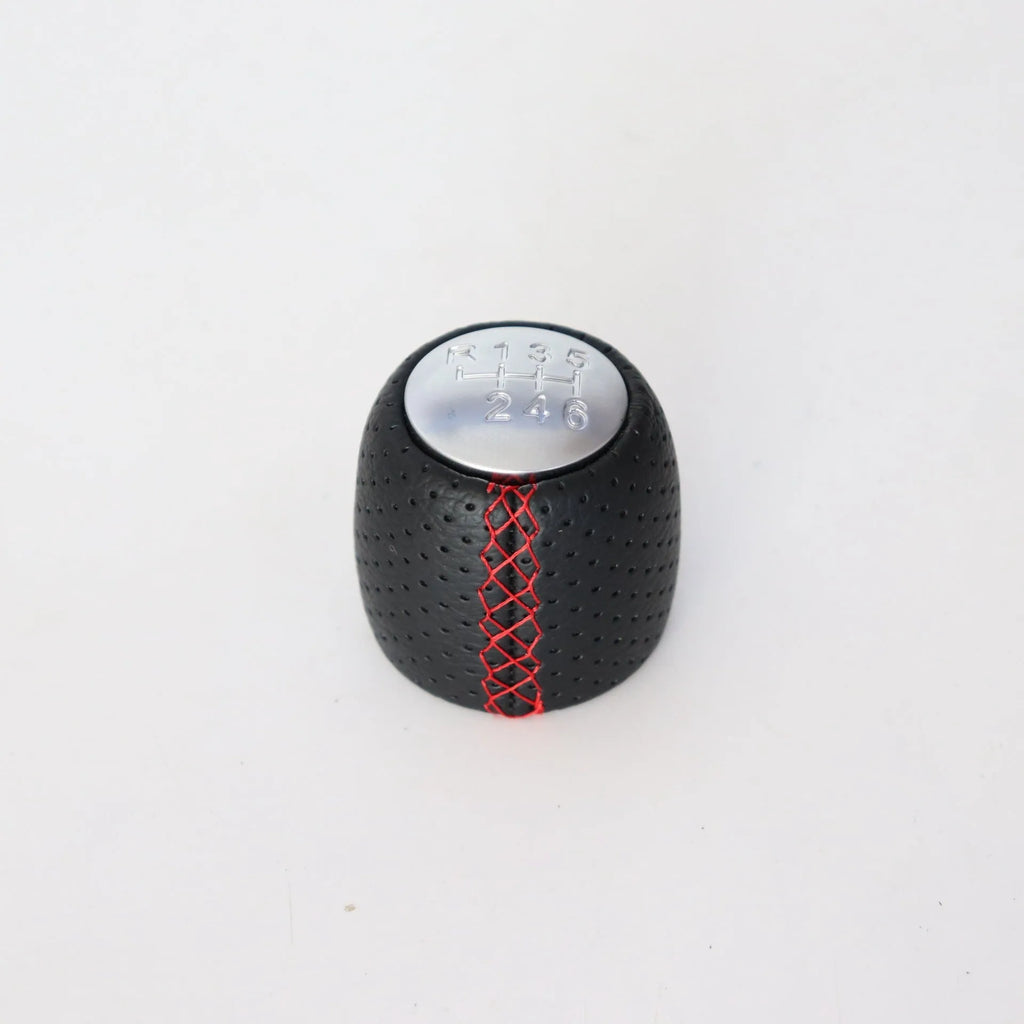 Sewn wrapped leather perforated handball gear for Alpha vehicles in matte and silver finishes