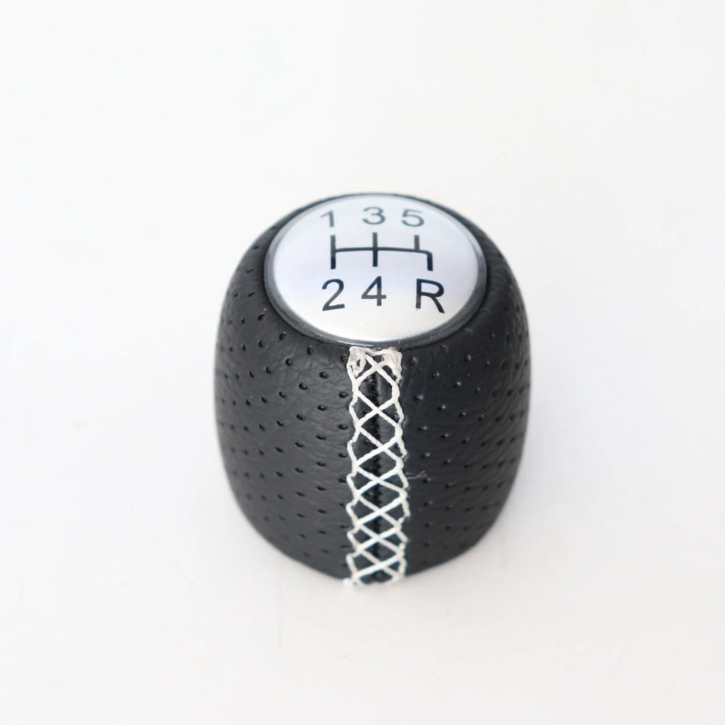 Sewn wrapped leather perforated handball gear for Alpha vehicles in matte and silver finishes