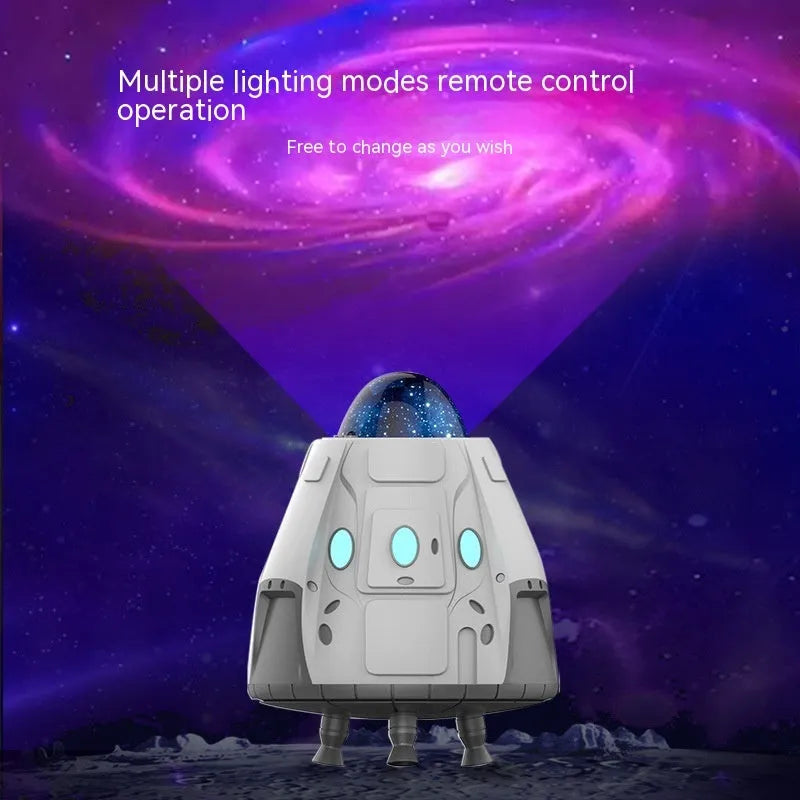 White remote control atmosphere light with Northern Lights projection on a dark wall