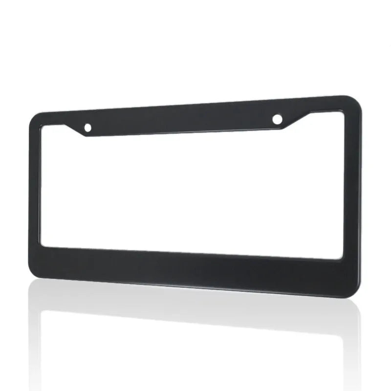 Minimalist black aluminium alloy car licence plate frame with slotted holes on a white background.