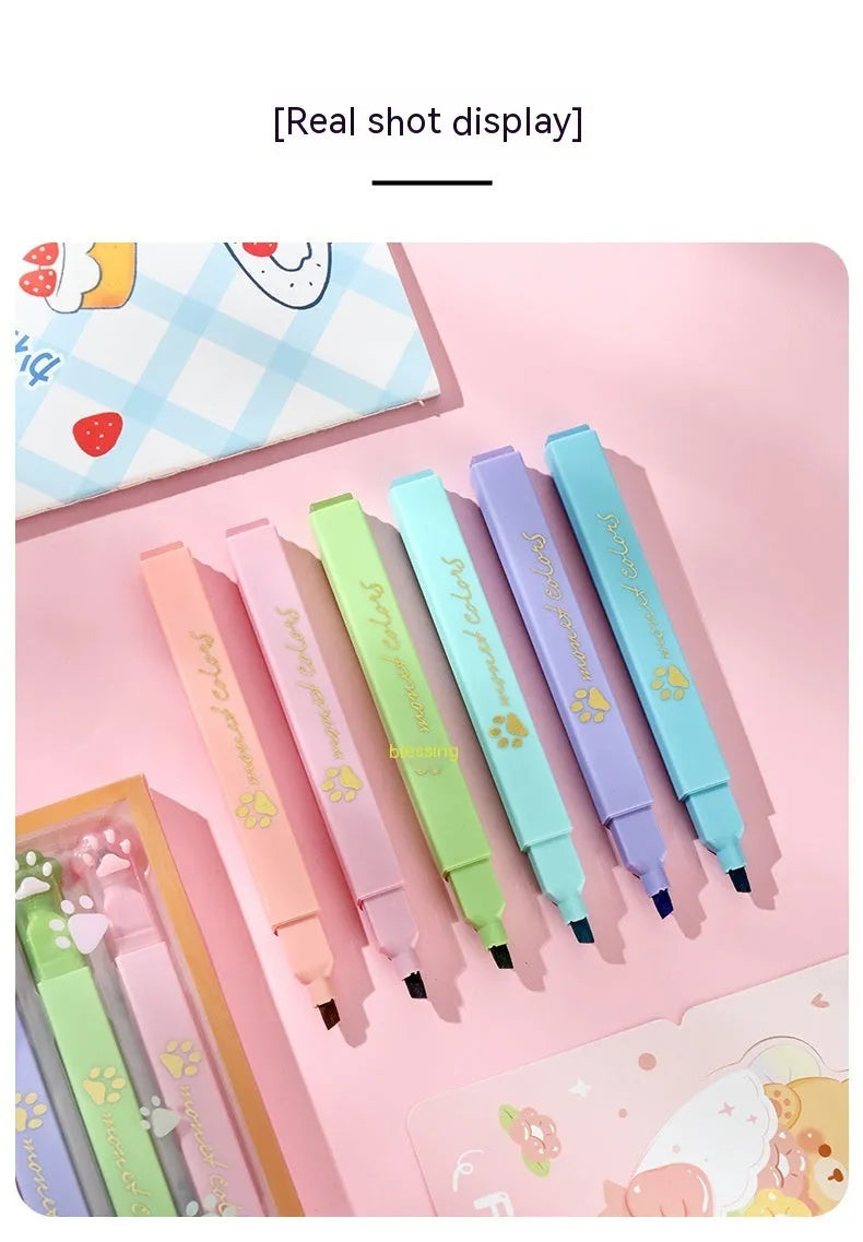 Box of six cat's paw fluorescent marking pens with oblique nib tips in assorted colours.