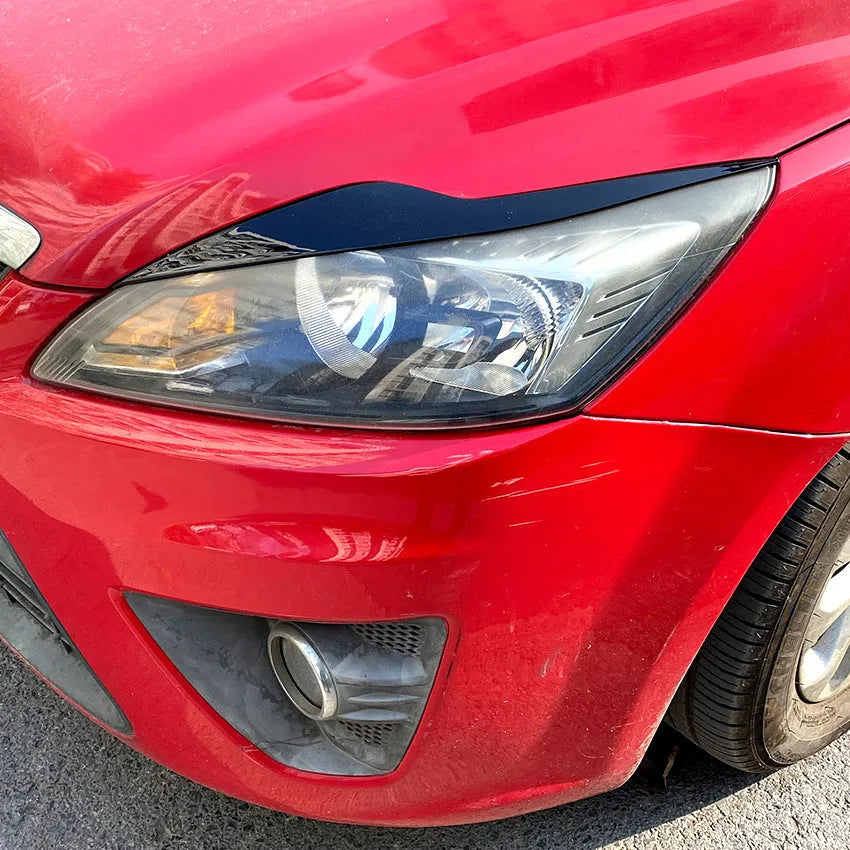 Ford Focus headlight eyebrow stickers in carbon fibre pattern and piano black finishes