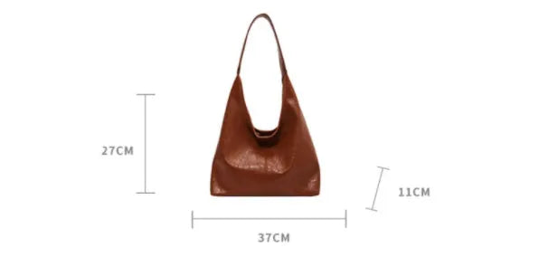Casual soft PU shoulder bag with sandwich pocket design in black colour showing dimensions and adjustable strap