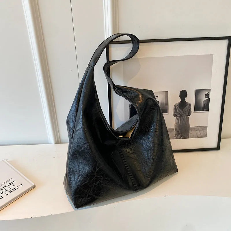 Casual soft PU shoulder bag with sandwich pocket design in black colour showing dimensions and adjustable strap
