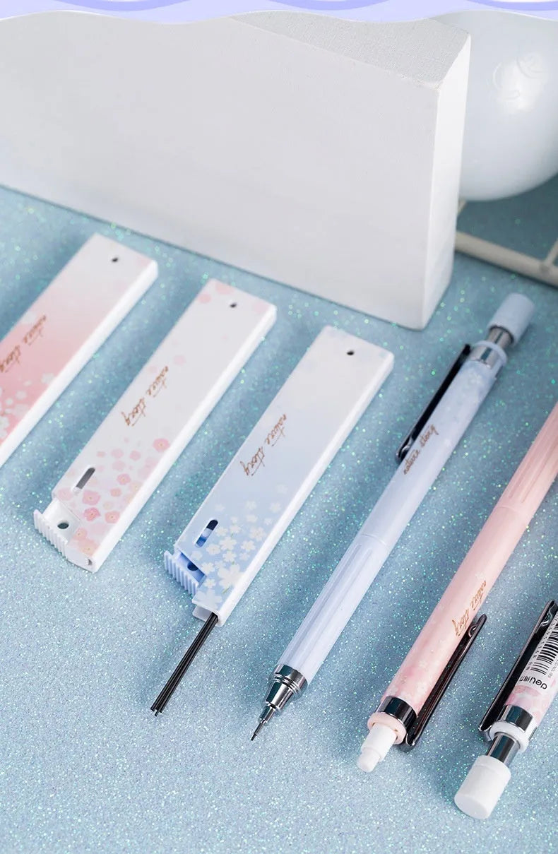 Simplified 0.5mm cartoon automatic pencil set showing three mechanical pencils and HB refill boxes