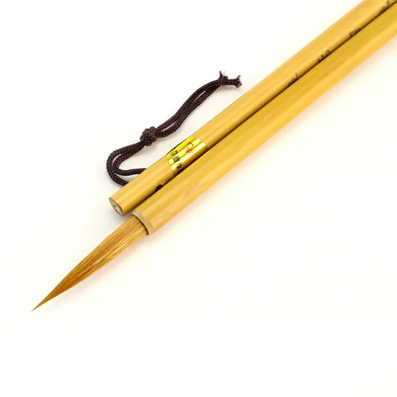 Langhao traditional Chinese calligraphy brush with wolf hair nib, shown beside ink and paper.