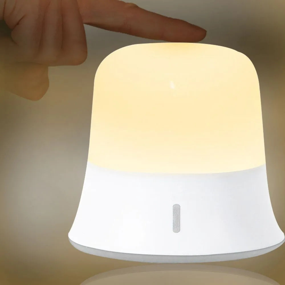White bedside nursing night light with touch controls for dimming and colour selection.