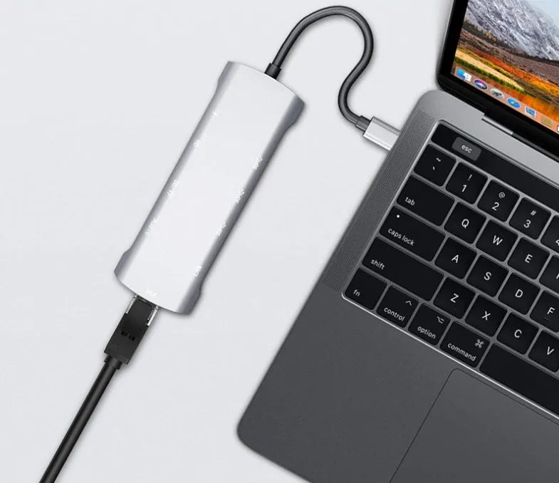 Grey USB-C docking station with HDMI, VGA, USB ports, and 140mm cable for laptop connectivity expansion