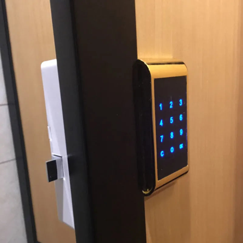 Silver zinc alloy digital code lock showing keypad, with dimensions 11.5 by 5.35 centimetres.