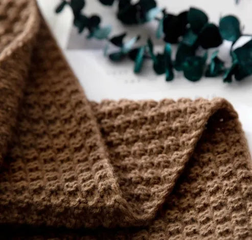 Nordic fringed knit ball blanket in beige colour showing 130×170cm dimensions and textured edge detail