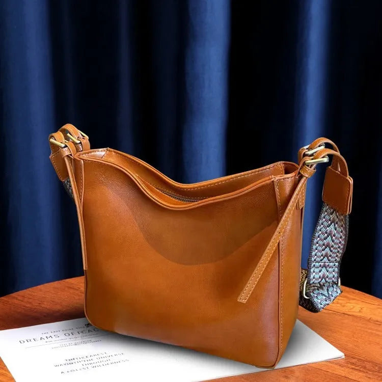 Women's large-capacity leather shoulder messenger bag in square vertical shape with multiple interior compartments