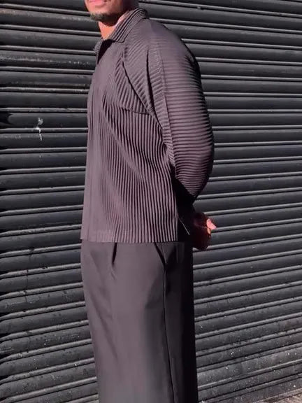 Black men's long-sleeved casual top with pleated detail on the front.